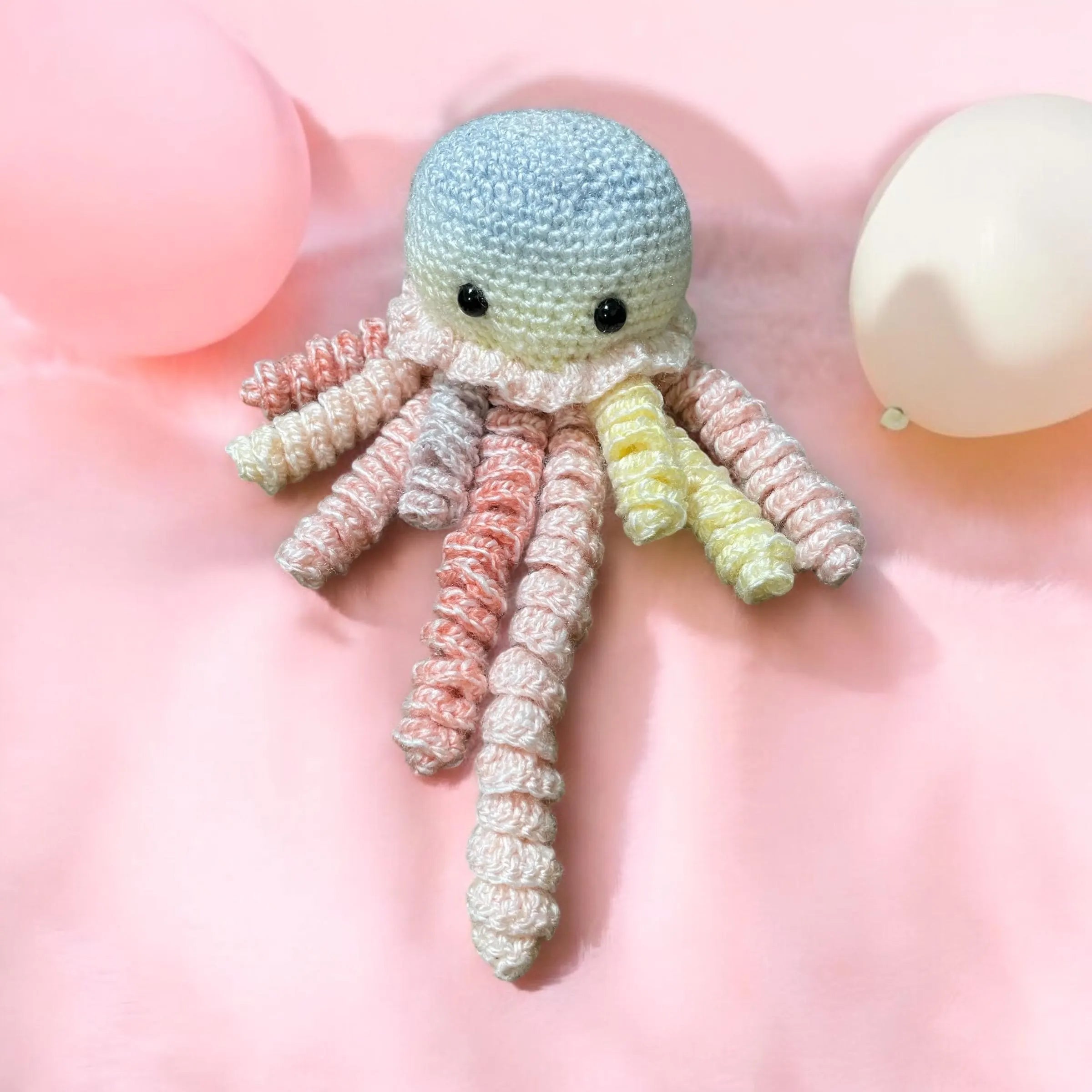 Crochet baby comforter with rainbow tentacles