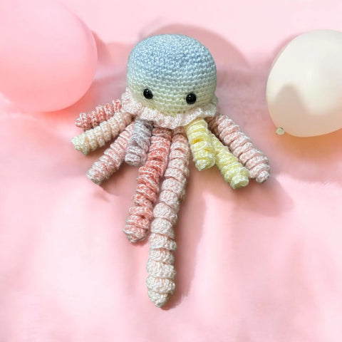 Crochet baby comforter with rainbow tentacles