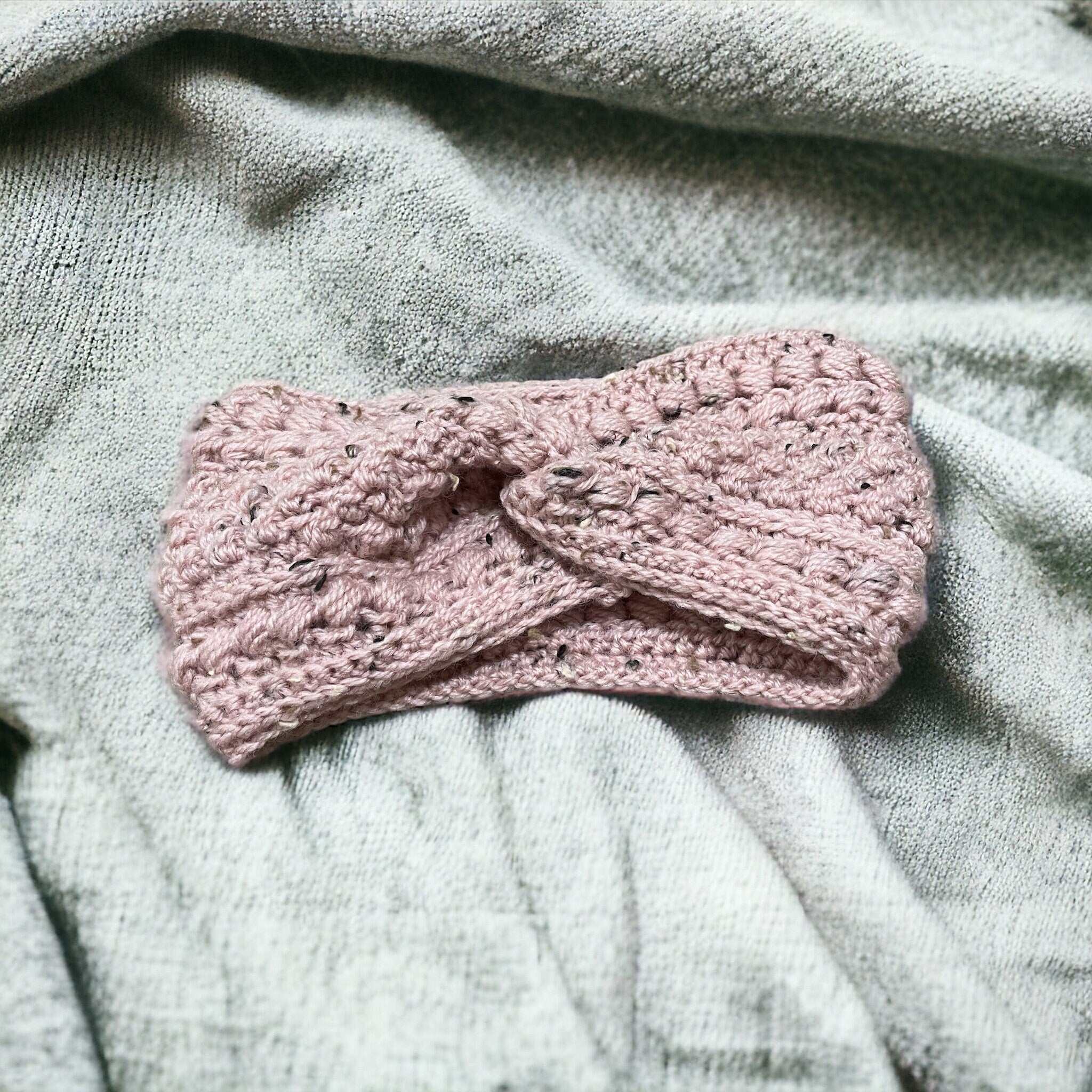 Soft wool crochet ear warmer in neutral winter colour

Stylish crochet headband ear warmer with bobble detail

Handmade winter crochet accessory – cozy ear warmer