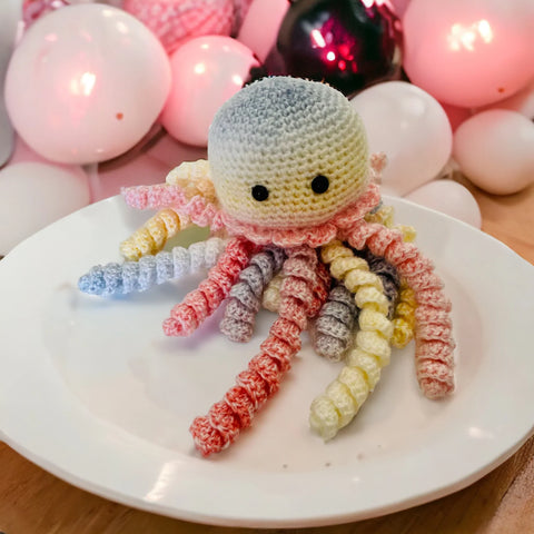 Handmade crochet octopus jellyfish baby toy in rainbow colors