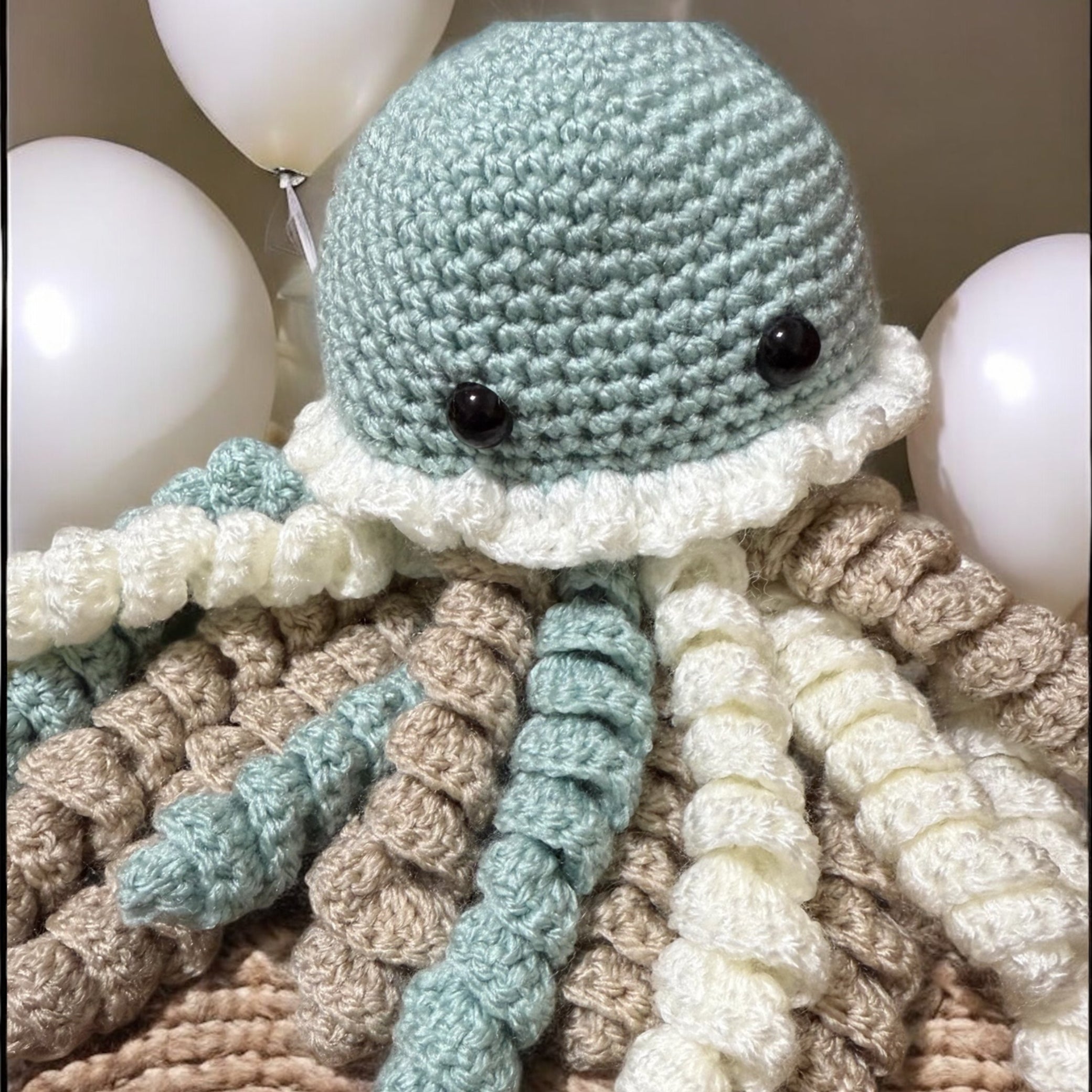 Handmade crochet jellyfish toy in nursery setting