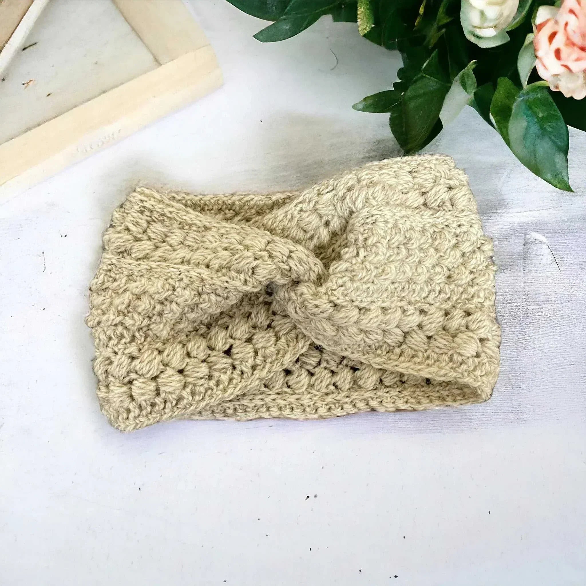 Handmade crochet bobble headband in grey – winter ear warmer

Chunky knit crochet ear warmer headband – cozy winter accessory

Handmade crochet headband in multiple colours – UK winter fashion

Close-up of crochet bobble stitch headband – handmade ear warmer

Woman wearing handmade crochet headband – stylish winter outfit