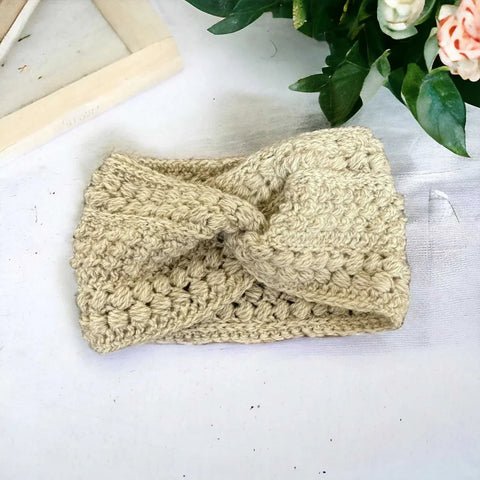 Handmade crochet bobble headband in grey – winter ear warmer

Chunky knit crochet ear warmer headband – cozy winter accessory

Handmade crochet headband in multiple colours – UK winter fashion

Close-up of crochet bobble stitch headband – handmade ear warmer

Woman wearing handmade crochet headband – stylish winter outfit