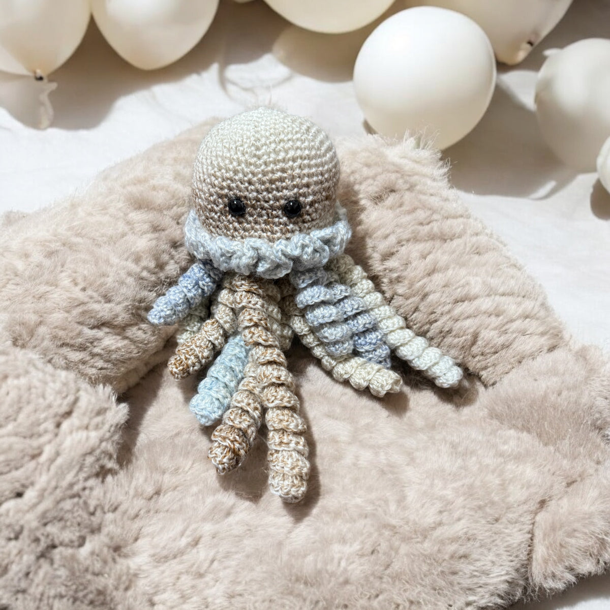 Handmade crochet octopus baby toy with tentacles