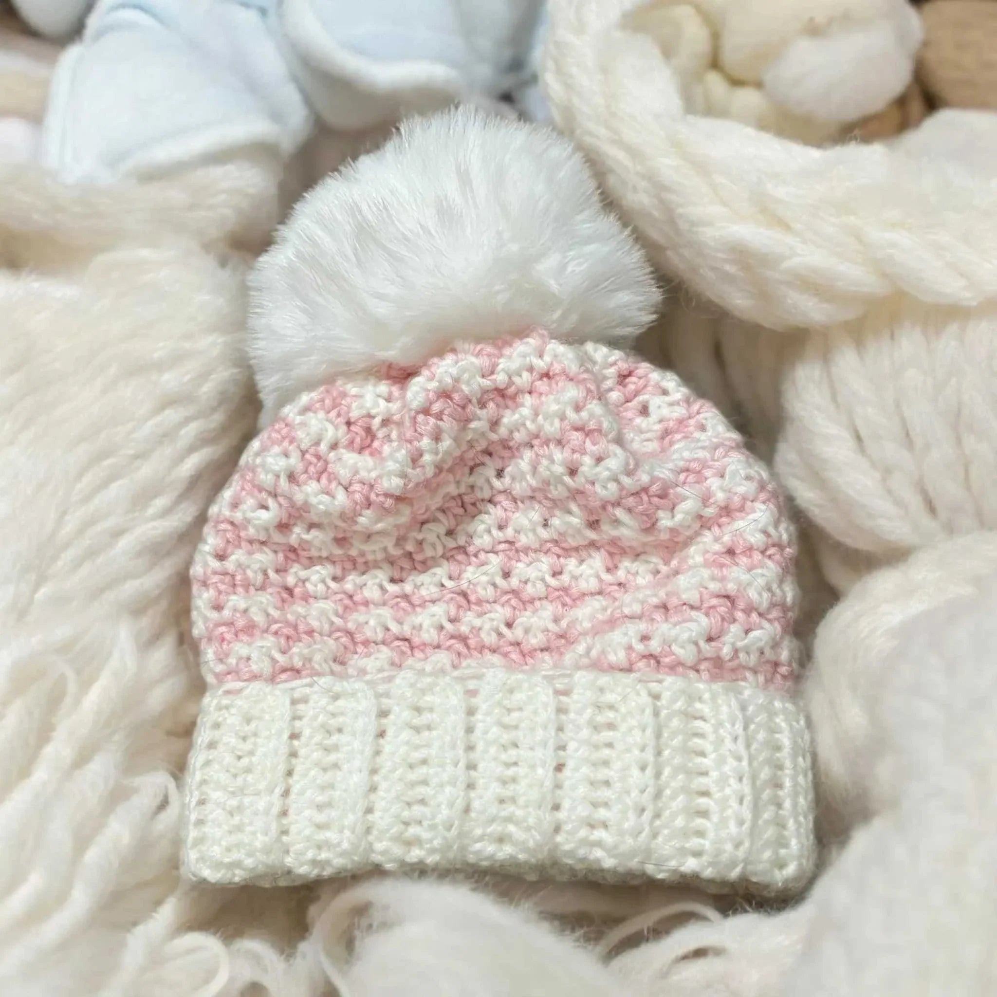 Newborn wearing organic cotton knit baby beanie hat