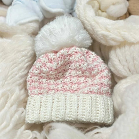 Newborn wearing organic cotton knit baby beanie hat