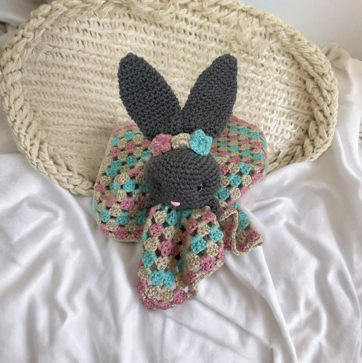 Soft crochet baby comforter blanket in nursery settings