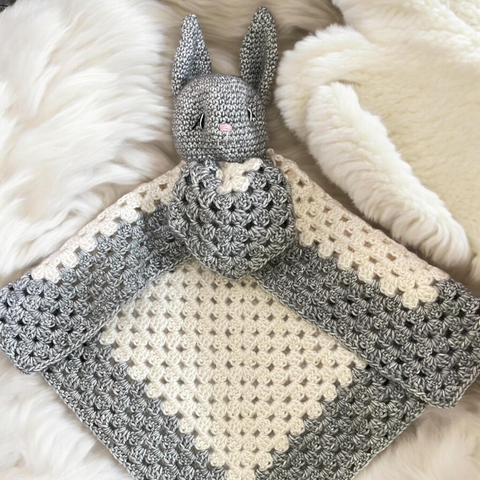 Handmade crochet bunny baby comforter blanket in nursery