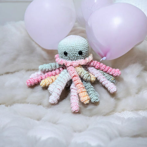 Handmade crochet octopus nursery toy