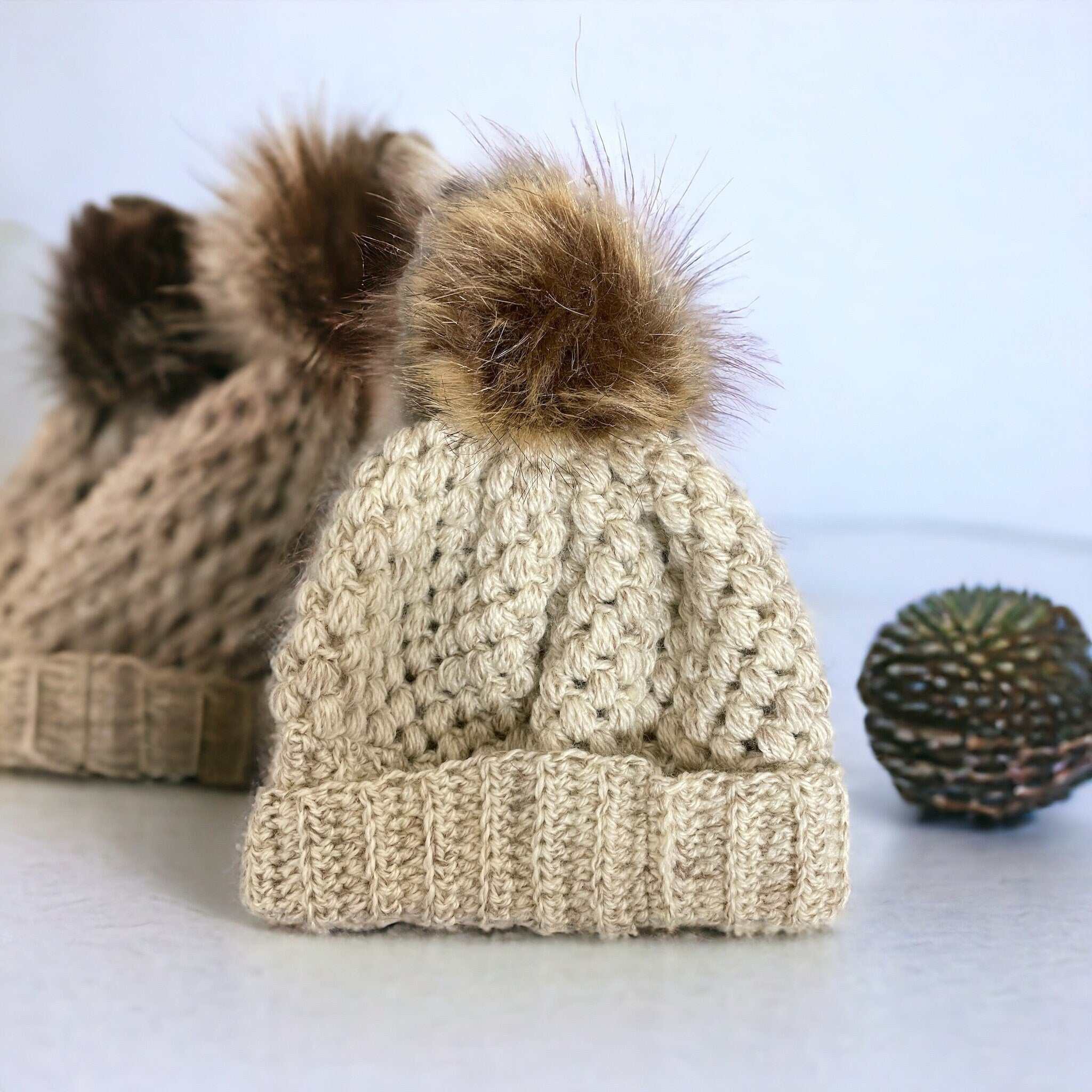 Handmade chunky crochet winter beanie hats, crafted from soft wool and acrylic blend for warmth, featuring a stylish design that adds flair to any winter outfit.